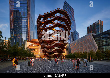 Hudson Yards esplanade with The Vessel (staircase) and the Shed at sunset in summer. Midtown West, Manhattan Stock Photo