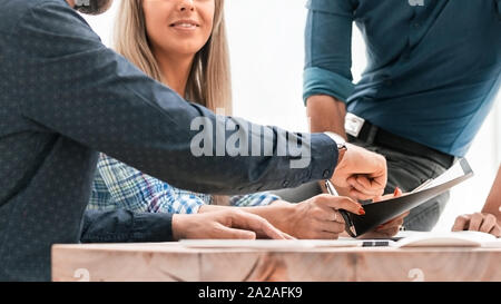 colleagues extending their hands to each other for a handshake Stock Photo