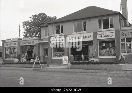 1960s, historical, Exterior of the cafe and restaurant at Lovers Leap, Gretna Green, Dumfries, Scotland. Adjacent to the famous Old Blacksmith's Shop, an historic wedding venue since 1754, famous for its 'Marriage Room', which held so -called 'runaway marriages', as Scottish law was different to that in England, where one had to be 21 and get married in a church. In Scotand, one could marry on the spot, a 'marriage by declaration, only requiring two witnesses and assurances from the couple that they were both free to marry and as Gretna Green was just over the border from England, many did! Stock Photo