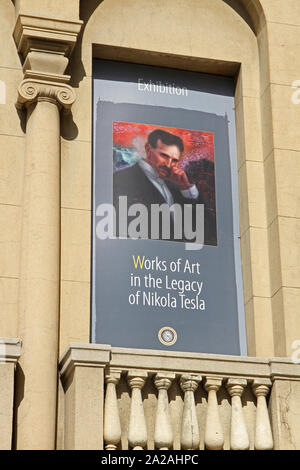 Poster advertising Works of Art in the legacy of Nikola Tesla Exhibition on the front facade of the Nikola Tesla Museum, Central Belgrade, Serbia. Stock Photo