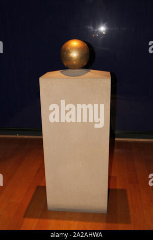 Golden sphere urn containing Nikola Tesla's ashes on display stand, Nikola Tesla Museum, Serbia. Stock Photo