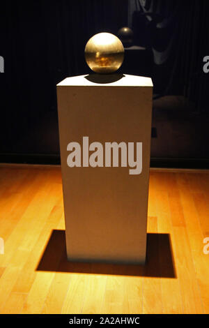 Golden sphere urn containing Nikola Tesla's ashes on display stand, Nikola Tesla Museum, Serbia. Stock Photo