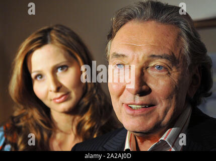 Czech pop-star singer Karel Gott, right, and his newlywed wife Ivana Gottova meeting media in Prague Moevenpick Hotel on Monday, Jan. 14, 2008. Czech Stock Photo