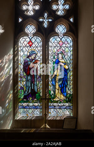 Saint Luke and Blessed Virgin Mary stained glass window by Henry Haig, design Karl Parsons, Shalbourne, Wiltshire 1995 Stock Photo