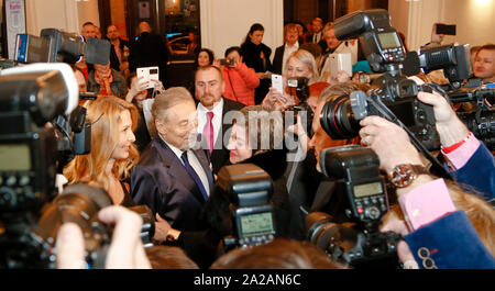 Czech singer Karel Gott (centre, accompanied by his wife Ivana Gottova, left) attends the premiere of musical 'The Time of Roses', based on famous son Stock Photo