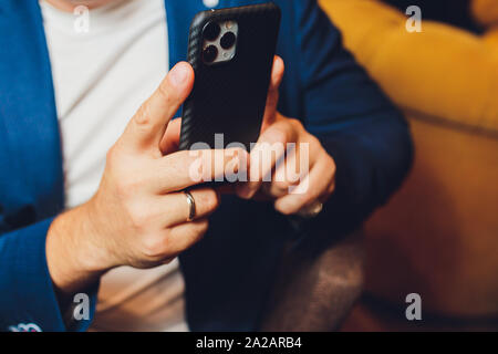 Ufa, Russia, 24 September, 2019: The iPhone 11 Smartphone back triple camera with blurry copy space Stock Photo