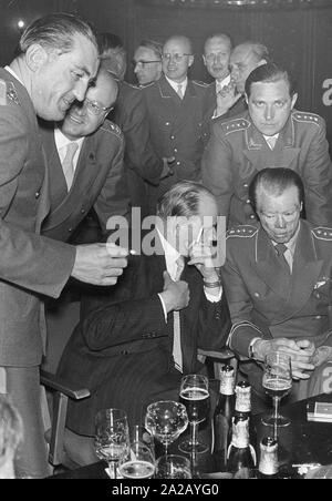 The first Minister of Defence of the Federal Republic of Germany, Theodor Blank (seated, left) talking to Johannes Steinhoff, General of the Luftwaffe (seated, right). Stock Photo