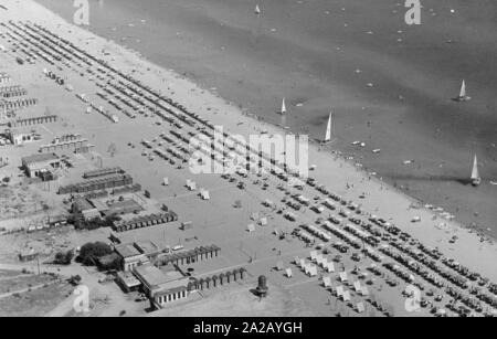 Thousands of sun shades on the beach of Cesenatico. Here, as on the whole Italian Adriatic coast, the tourism business is booming. Stock Photo