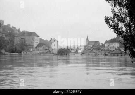 The flood in Passau and other parts of Lower Bavaria (July, 1954) were also referred to as the flood of the century. The Danube, the Inn and the Ilz had overflowed their banks, and flooded towns and villages.  Here, view of the flooded city of Passau. Stock Photo