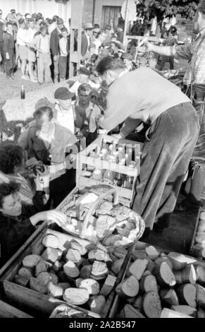 The flood in Passau and other parts of Lower Bavaria (July, 1954) were also referred to as the flood of the century. The Danube, the Inn and the Ilz had overflowed their banks, and flooded towns and villages. Photo of the support of local residents and volunteers with food. Stock Photo