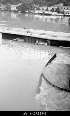 The flood in Passau and other parts of Lower Bavaria (July, 1954) were also referred to as the flood of the century. The Danube, the Inn and the Ilz had overflowed their banks, and flooded towns and villages.  Photo of a flooded district of Passau. Stock Photo