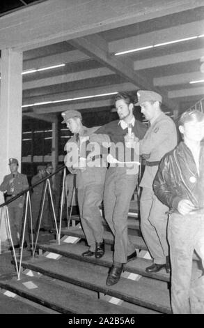 Members of the Ausserparlamentarische Opposition (extra-parliamentary opposition APO) gained access to an election campaign of the CSU with forged tickets in the Bayernhalle in Munich. Photo of police officers removing members of the APO on a staircase leading to the hall. Stock Photo