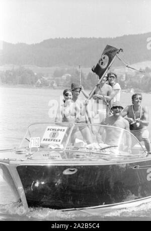Photo of participants of a not quite seriuos motor boat rally across Woerthersee disguised as pirates, in which some celebrities and their friends took part as well. Stock Photo