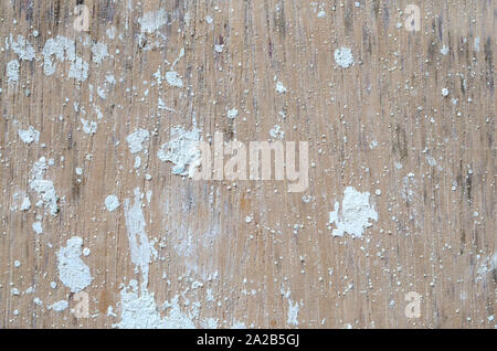 A very old wooden slat wall with serverly distressed and cracked paint Stock Photo