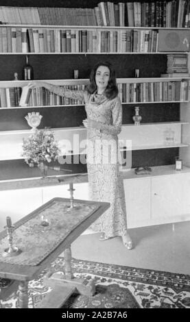 The German actress Karin Dor is photographed in front of a bookshelf. Stock Photo