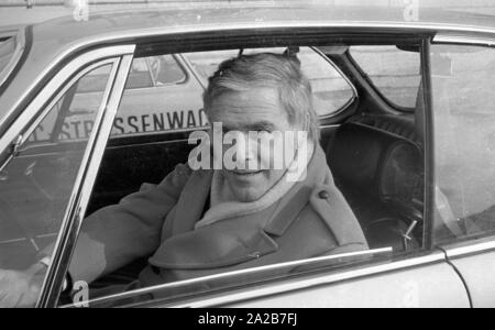 The ADAC carries out exhaust gas measurements on the Koenigsplatz in Munich. The actor Blacky Fuchsberger sits at the wheel of the BMW. Stock Photo