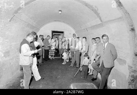 A group of tourists visit the Berghof Bunker in Berchtesgaden. Stock Photo