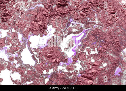 Pink spray oil blots on ice make a very fine grungy background Stock Photo