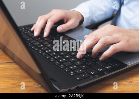 Businesswoman's hands typing on laptop keybord. Stock Photo