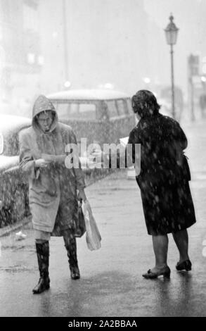 As part of a campaign against narcotics in Munich, Ms. Baumann distributes the publication of the Süddeutsche Zeitung 'Das vergiftete Gehirn' ('The Poisoned Brain') to passers-by. Stock Photo