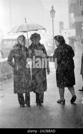 As part of a campaign against narcotics in Munich, Ms. Baumann distributes the publication of the Süddeutsche Zeitung 'Das vergiftete Gehirn' ('The Poisoned Brain') to passers-by. Stock Photo