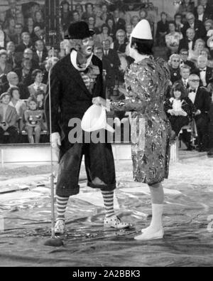 Clowns perform a classic clown act with a funnel in the TV show 'Stars in the Manege' in 1971. Stock Photo