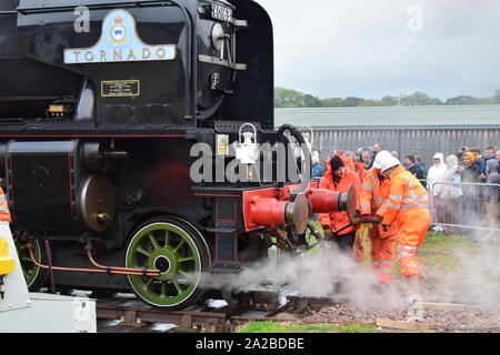 Volunteers turning Tornado steam engine on turntable at Ferryhill Railway Heritage Trust Aberdeen Stock Photo