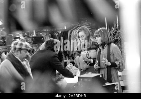 Photo shoot with Austrian actress Christine Schuberth (r.) in a shoe store. Stock Photo