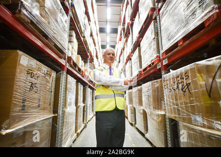Director of Programmes NHS Wales Mike Roscrow between aisles of medical supplies, which are being stockpiled as part of Brexit preparations at a NHS Wales warehouse in South Wales. The warehouse is storing extra medical devices and consumables to ensure health and social services continue to run smoothly in the event of a no-deal Brexit. Stock Photo