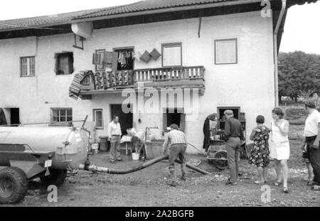 Cleaning-up operations after a heavy storm in a place on the Chiemsee. Stock Photo