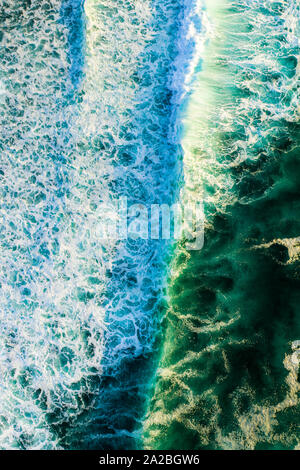 Aerial looking straight down onto large swell and waves in Bali Stock Photo