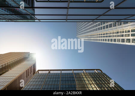 Modern city skyscrapers in bright sunlight with reflections Stock Photo