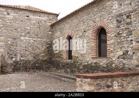 A couple of rounded arch windows of a medieval building with bricks (Madeira, Portugal) Stock Photo