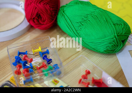 needlework materials,  multi-colored threads,  pins, needles, scotch tape Stock Photo
