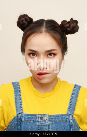 Close up photo beautiful amazing she her lady two hair buns bite lip oh no sorry guilty despair expression wear a jeans dungaree Stock Photo