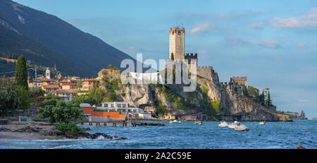 Malcesine - The beach of Lago di Garda lake with the town and castle in the background. Stock Photo