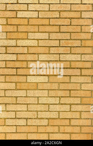 Stylish yellow brick wall outside Stock Photo