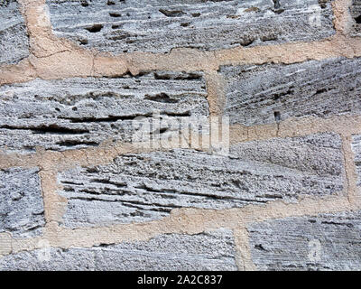 Wall constructed of local volcanic rock in Bermuda Stock Photo
