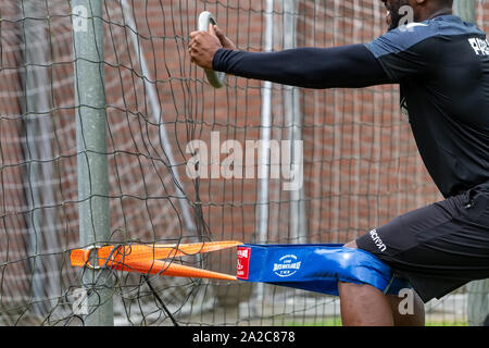 Horst, Netherlands - June 25, 2018: Close up of PAOK players and football training equipment during the training of the team on the pitch Stock Photo