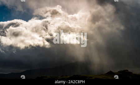 Heavy down pour of rain over the English countryside with storm clouds Stock Photo