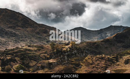 Aerial view looking over hills and fens towards mountains in the Lake district Stock Photo