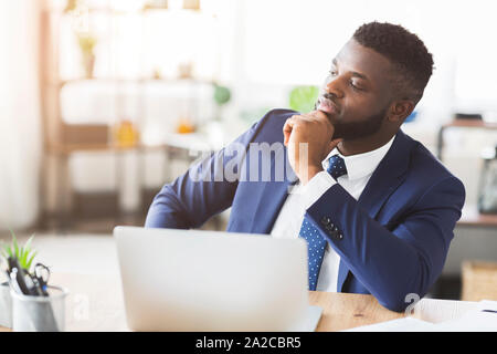 Pensive businessman working on new business plan in office Stock Photo