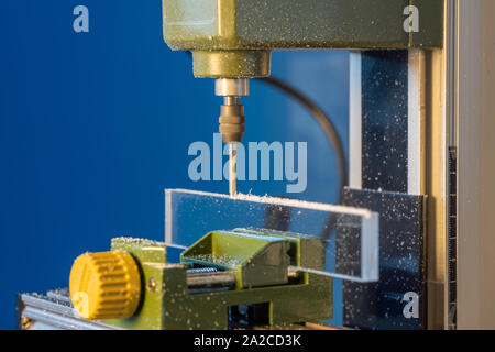 CNC  milling machine processes glass Stock Photo