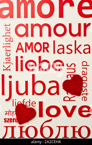 love written in many languages and two heart shapes Stock Photo