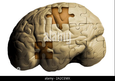 human brain and jigsaw puzzle with missing pieces - Alzheimer Stock Photo