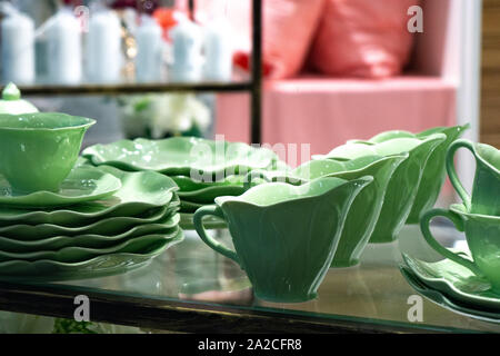 Green Faience. Coffee set for sale. Dishes are for sale Stock Photo
