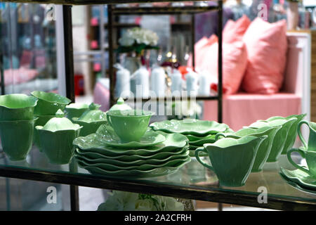 Green Faience. Coffee set for sale. Dishes are for sale Stock Photo