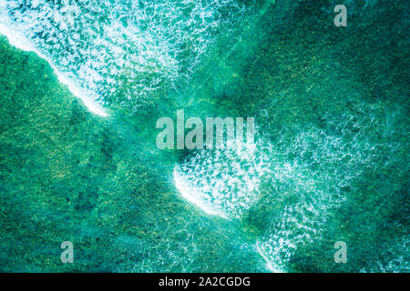 Aerial view looking straight down onto large waves in a tropical ocean Aerial view looking straight down onto large waves in a tropical ocean