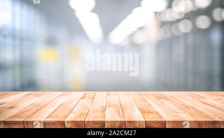Wood table top on blur window glass,wall background.For montage product display or design key visual layout Stock Photo