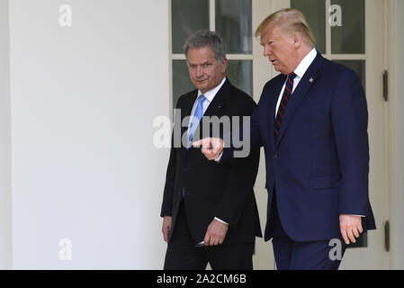 Washington, United States. 02nd Oct, 2019. President Donald Trump (R) shows the way as he escorts Finland's President Sauli Niinisto along the Colonnade of the White House to the Oval Office, Wednesday, October 2, 2019, in Washington, DC. The leaders will hold a working lunch and a joint press conference. Photo by Mike Theiler/UPI Credit: UPI/Alamy Live News Stock Photo